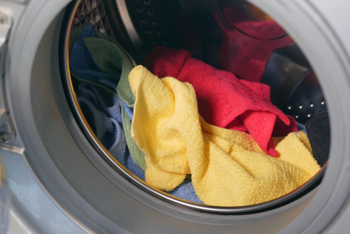 Towels tumbling inside a washer drum